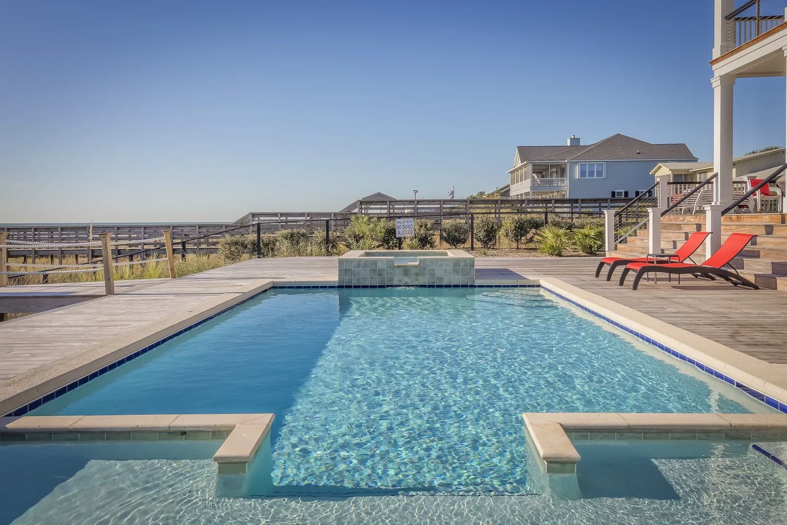 Luxury pool deck with palms and bright Florida light